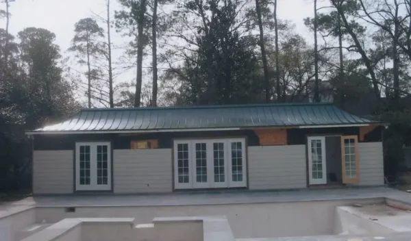 Standing-seam metal roof installed on a pool house in Houston